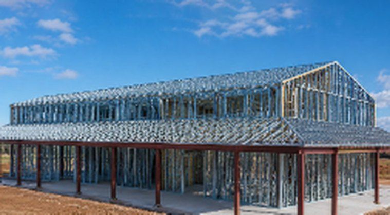 Two-story steel frame with red structural posts